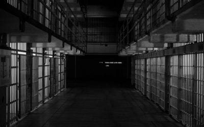 How has the COVID-19 pandemic impacted prisons? 🔊